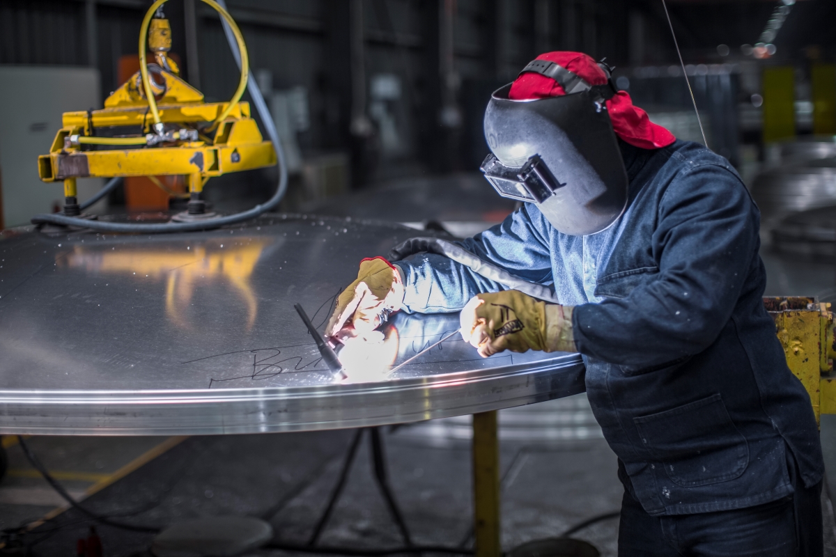 worker-welding-in-factory-with-aluminum